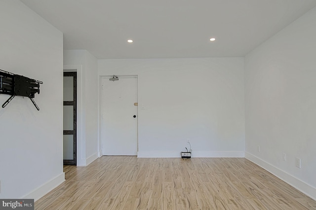 spare room featuring light hardwood / wood-style floors