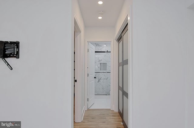 hall with light hardwood / wood-style flooring