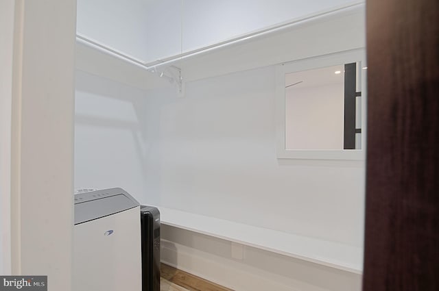 laundry area featuring hardwood / wood-style flooring