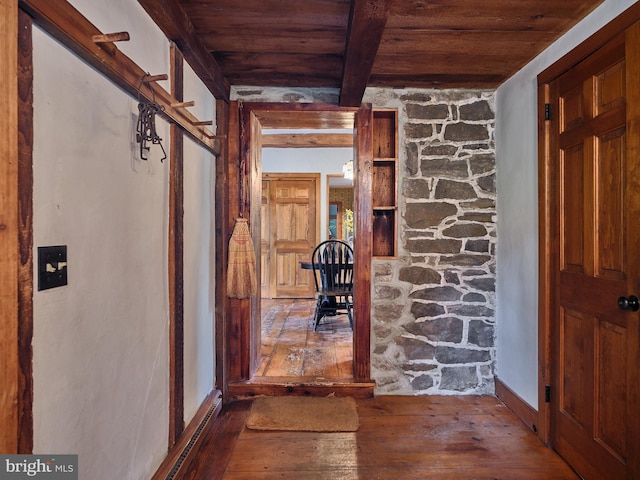 interior space featuring wood ceiling, beam ceiling, and hardwood / wood-style flooring