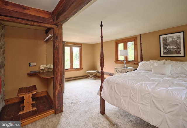 carpeted bedroom featuring a baseboard radiator