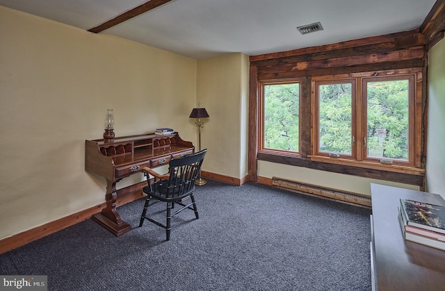 carpeted office space with a baseboard heating unit