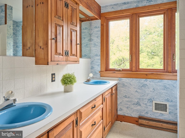 bathroom with vanity and a healthy amount of sunlight