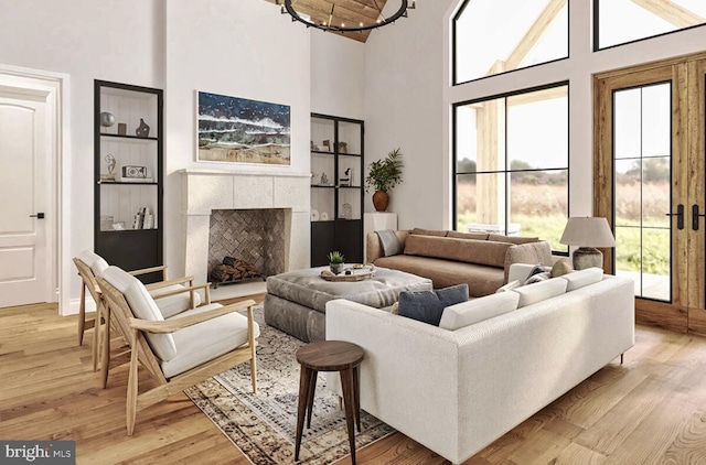 living room featuring a healthy amount of sunlight, a tile fireplace, and wood-type flooring