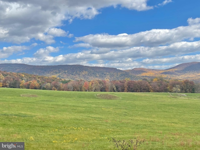 view of mountain feature with a rural view