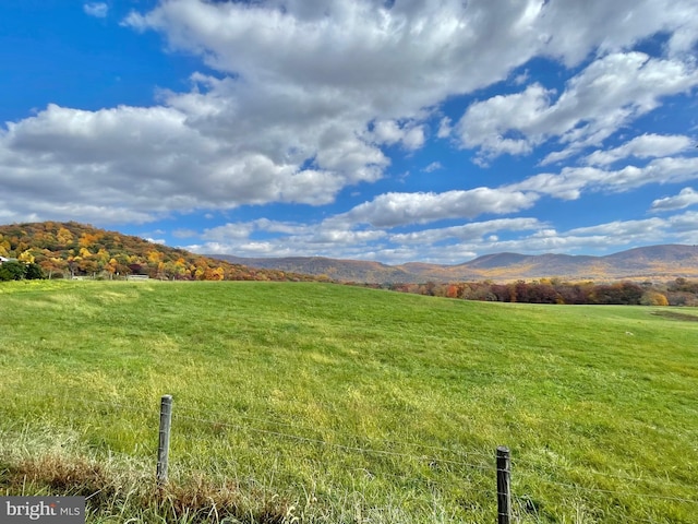 view of mountain feature with a rural view