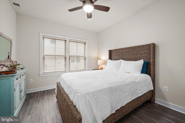 bedroom with ceiling fan and dark hardwood / wood-style flooring