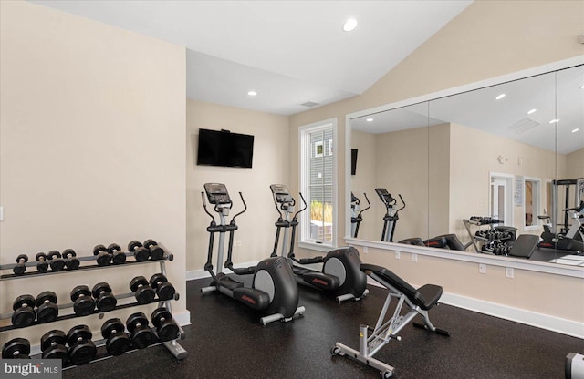 exercise room featuring vaulted ceiling