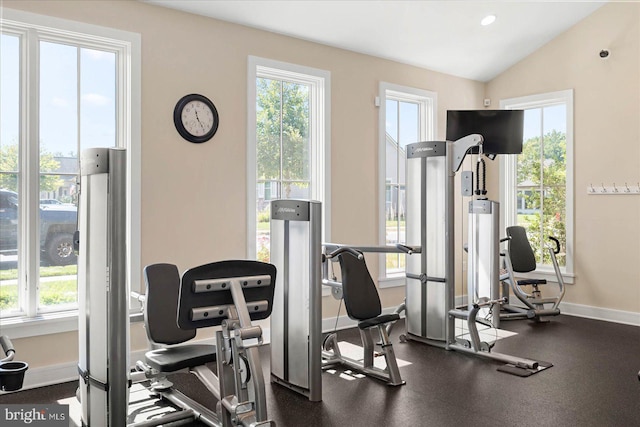 exercise room featuring vaulted ceiling