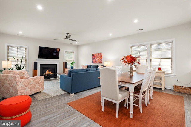 dining room featuring light wood-type flooring and ceiling fan