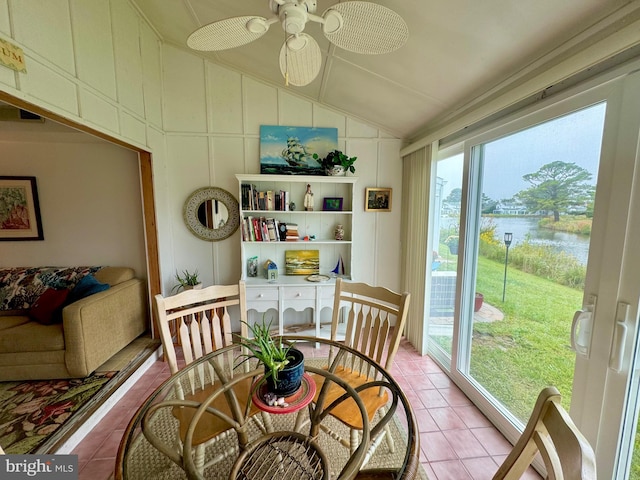 dining area featuring ceiling fan, lofted ceiling, light tile patterned floors, and a wealth of natural light