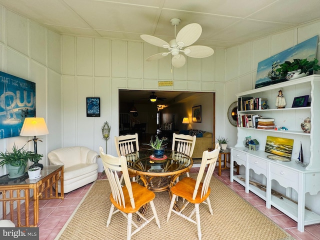 dining area featuring tile patterned flooring and ceiling fan