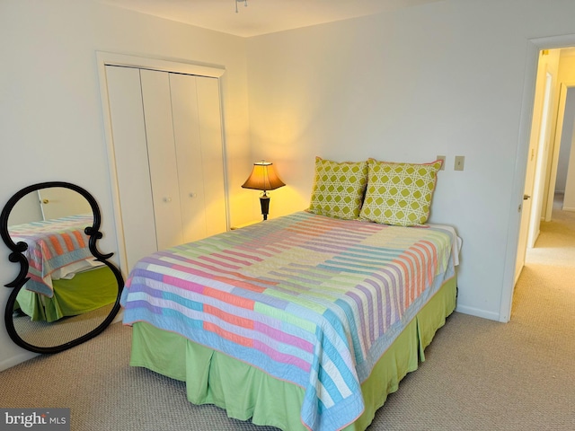 carpeted bedroom with a closet