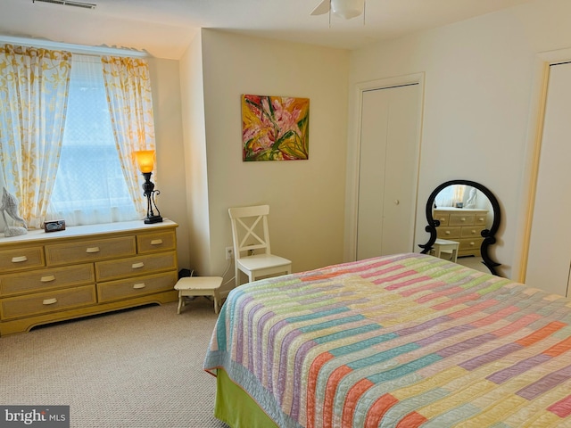 carpeted bedroom with ceiling fan