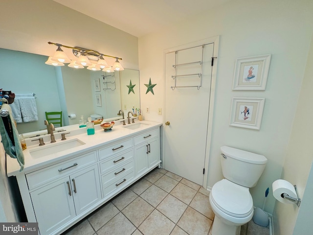 bathroom with vanity, tile patterned flooring, and toilet