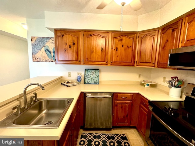 38421 Cardinal Ln Unit 195, Selbyville, DE 19975 - kitchen featuring light countertops, a sink, stainless steel appliances, and ceiling fan