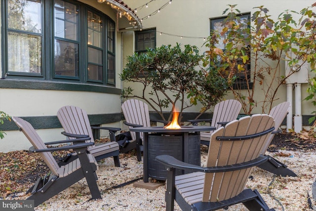 view of patio with an outdoor fire pit