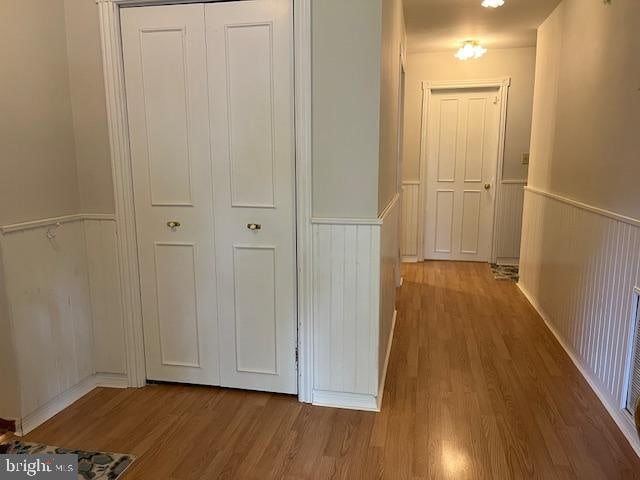 corridor featuring hardwood / wood-style floors