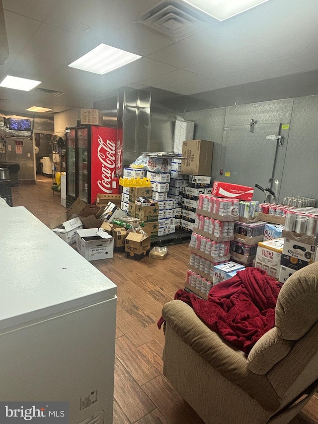 basement with dark hardwood / wood-style floors