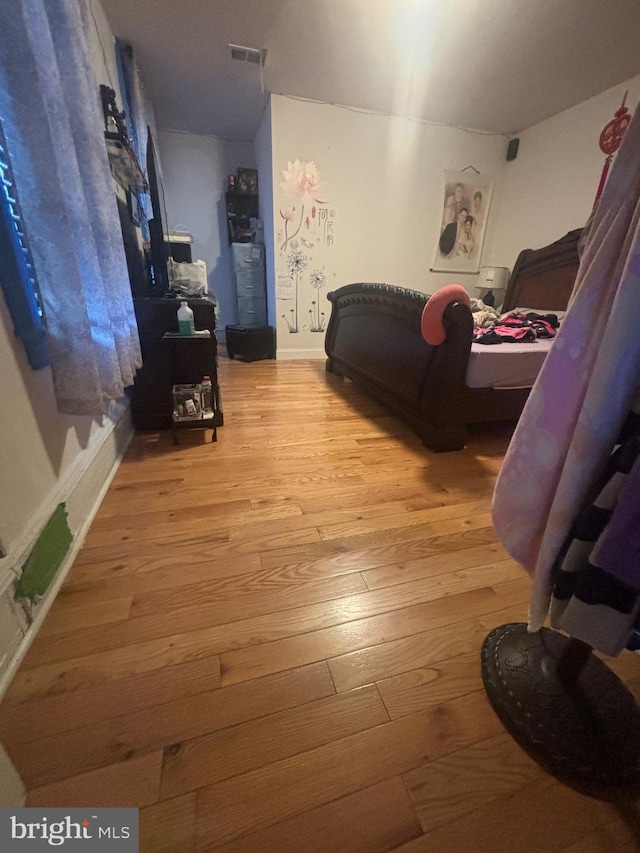 bedroom with light hardwood / wood-style floors