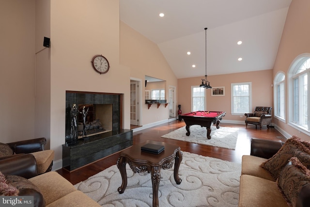 playroom with hardwood / wood-style flooring, high vaulted ceiling, and pool table