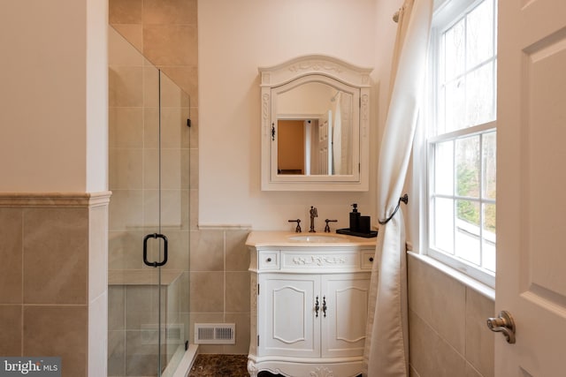 bathroom with vanity and walk in shower