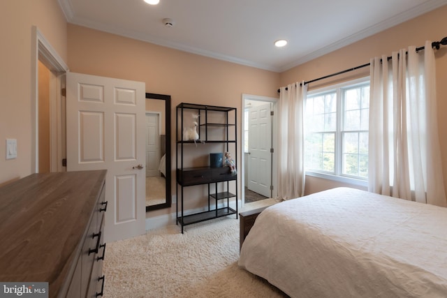 bedroom with carpet floors and ornamental molding