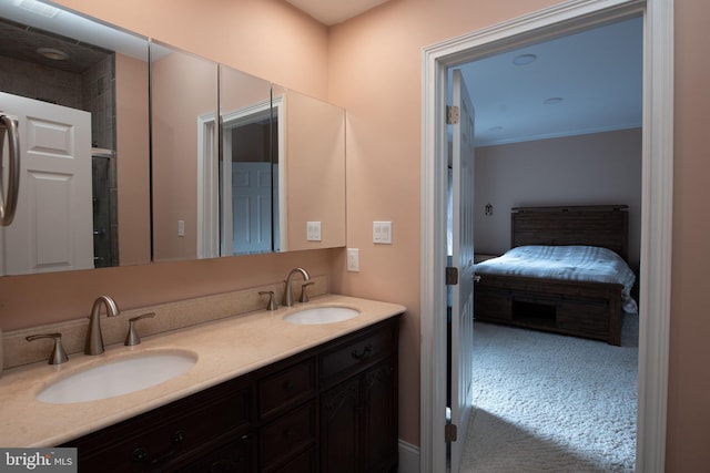 bathroom with vanity and ornamental molding