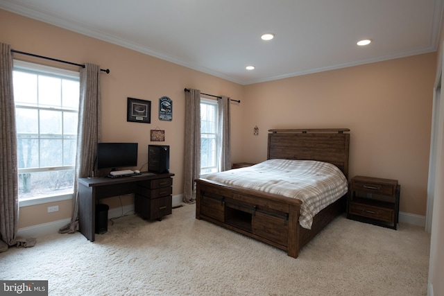 bedroom featuring light carpet and multiple windows