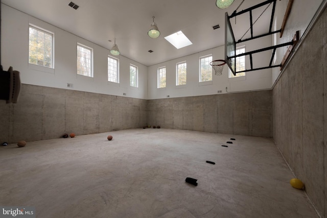 interior space with concrete floors and a skylight