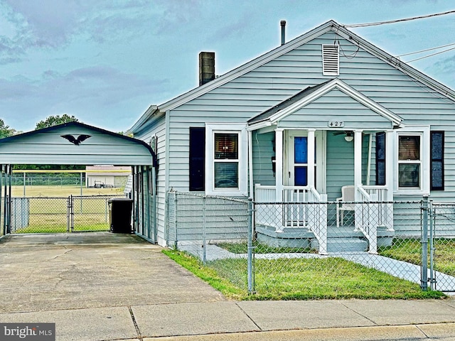 bungalow-style house featuring a carport and covered porch