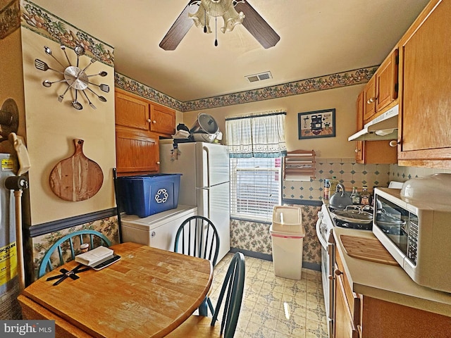 kitchen with ceiling fan and white appliances