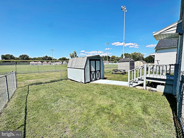 view of yard with a storage shed