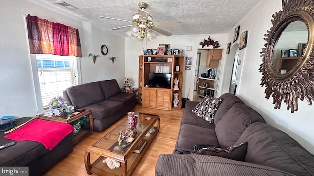 living room featuring ceiling fan and light wood-type flooring