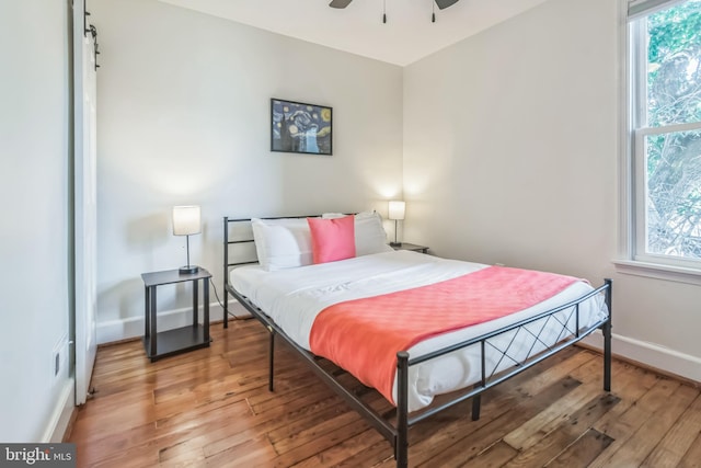 bedroom featuring hardwood / wood-style flooring and ceiling fan