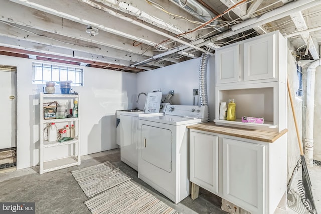 laundry area with cabinets and independent washer and dryer