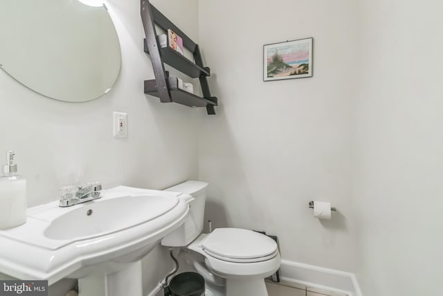 bathroom featuring tile patterned flooring and toilet