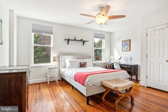 bedroom with light wood-type flooring and ceiling fan