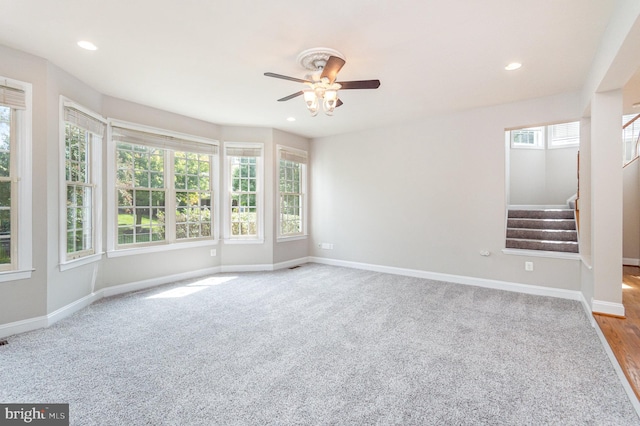 interior space with light hardwood / wood-style flooring, ceiling fan, and a wealth of natural light