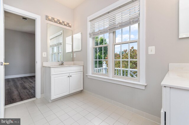 bathroom with vanity and tile patterned flooring