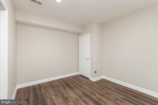 empty room featuring dark hardwood / wood-style floors