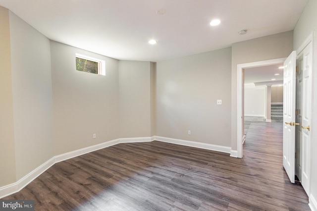 unfurnished room featuring dark hardwood / wood-style flooring