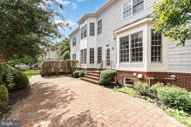 back of house with a patio