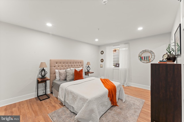 bedroom with light hardwood / wood-style flooring