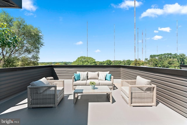 view of patio featuring a balcony and outdoor lounge area