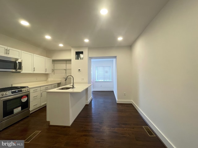 kitchen with white cabinetry, sink, dark wood-type flooring, and stainless steel appliances