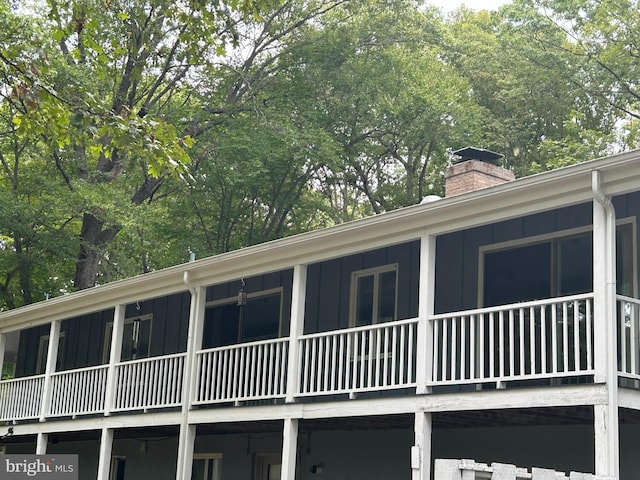 view of side of property with a balcony