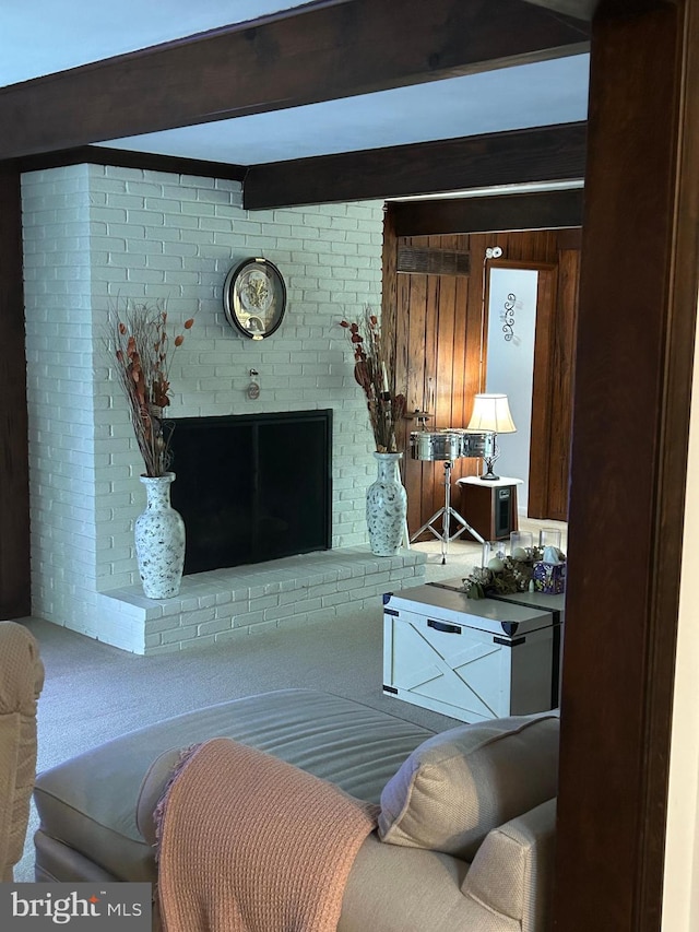 living room with carpet flooring and beam ceiling