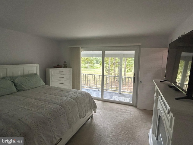 bedroom featuring access to outside and light colored carpet