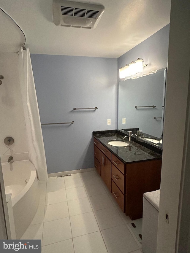 bathroom featuring tile patterned floors, vanity, and separate shower and tub